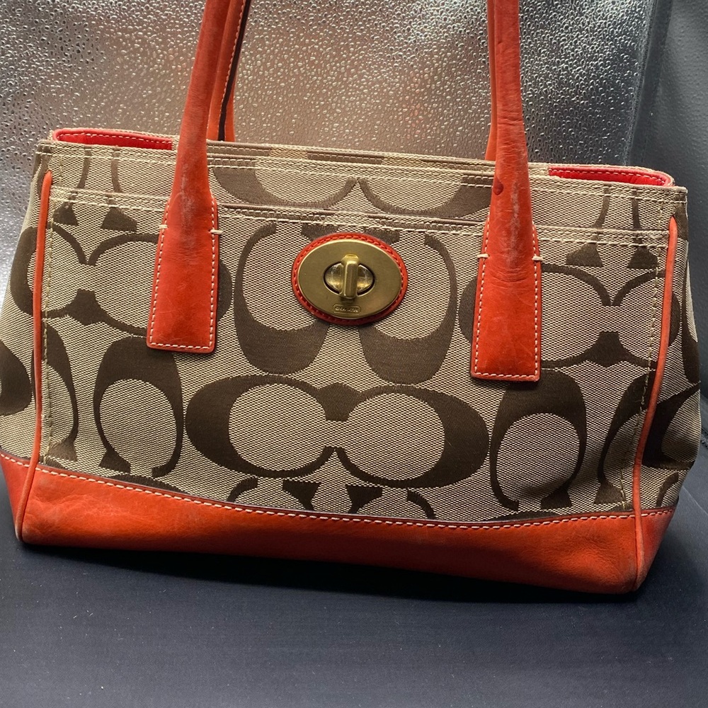 646 Coach #11557 Orange leather w signature canvas HAMPTON MADELINE”